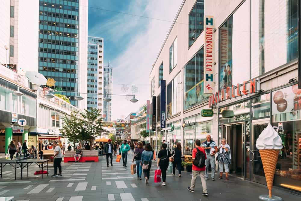 A city street in which there are people walking